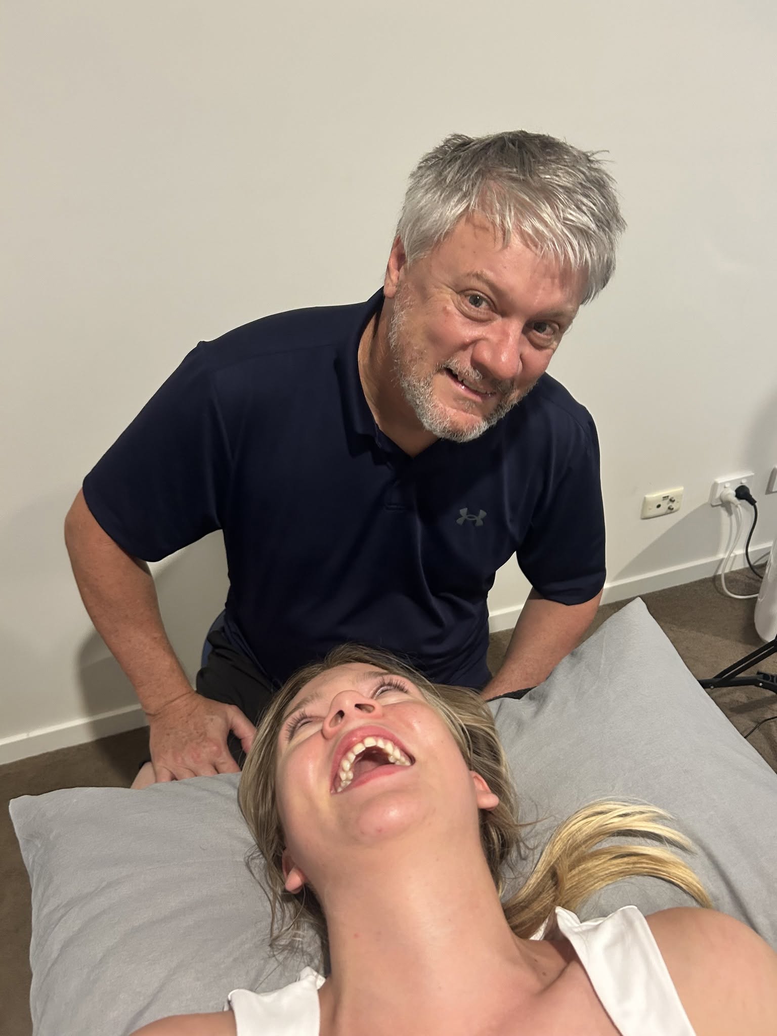 Dr John Gibson with a patient during a clinical treatment session